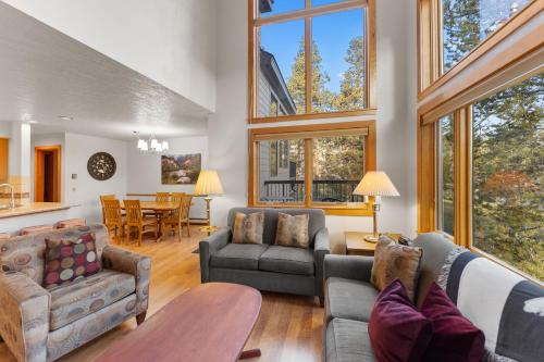 a living room with a couch and a table at Quicksilver #1631 in Keystone