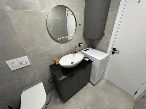 a bathroom with a sink and a mirror at Apartment Dantéa Novéa - NEW 2026 in Izola