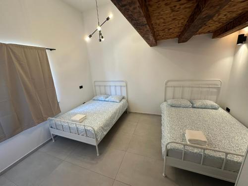 a bedroom with two beds in a room at Apartment Dantéa Novéa - NEW 2026 in Izola