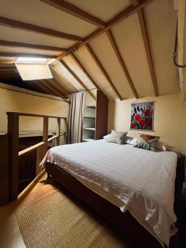 a bedroom with a large bed in a room at Coliving Granada in Envigado