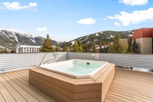 a bath tub sitting on top of a deck at Snowbridge Square #F206 in Copper Mountain