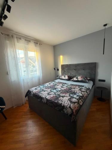 a bedroom with a large bed in a room at Room with jungle bathroom in Dubrovnik