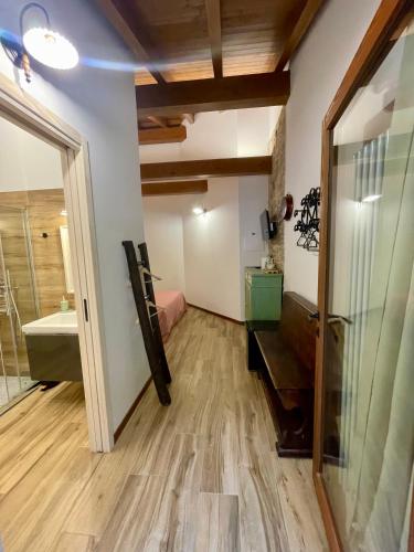 a room with a bathroom with a sink and a mirror at Casa Iris in Omegna