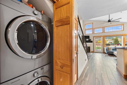 a kitchen with a washer and dryer in a house at La Riva Del Lago #204 in Dillon