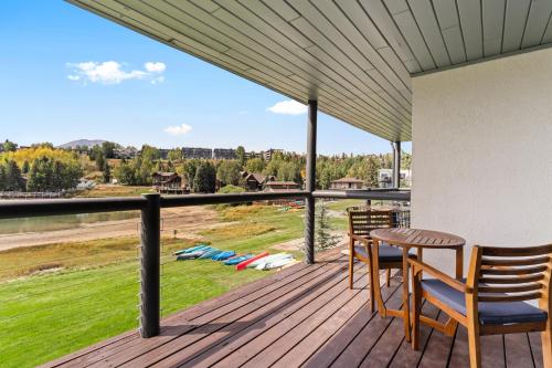 a porch with a table and chairs on a deck at East Bay Condos #111 in Dillon