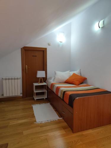 a bedroom with a bed and a lamp in it at San Isidro in Villarcayo