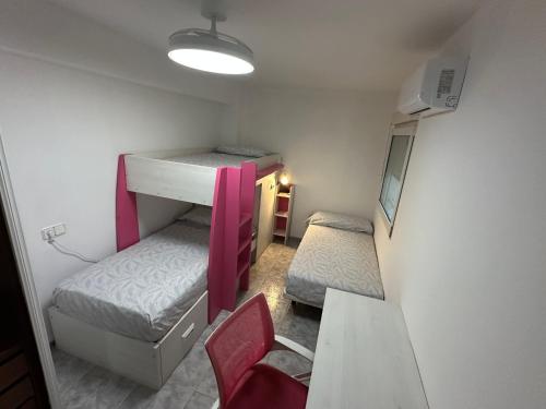 a small room with two bunk beds and a desk at TAJ house center Altea #C in Altea
