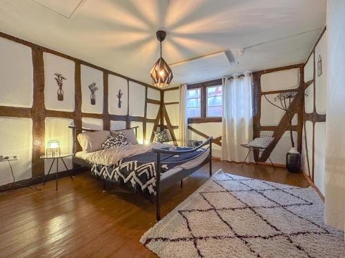 a bedroom with a bed in a room with a rug at Briedel in Briedel