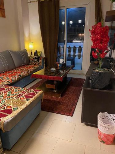 a living room with a couch and a table at Chalet in Belagio Ain Sokhna in Ain Sokhna