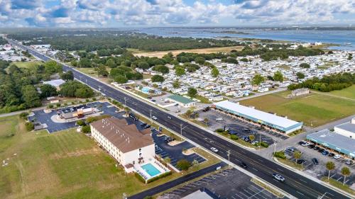 an aerial view of a town with a parking lot at The Windstar Hotel - Emerald Isle, Swansboro in Cedar Point