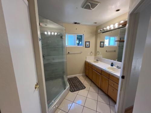 a bathroom with a shower and a sink at WM Private master suite with separate entry in San Jose