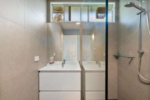 a bathroom with a sink and a shower at Nathan's Place in Whitfield