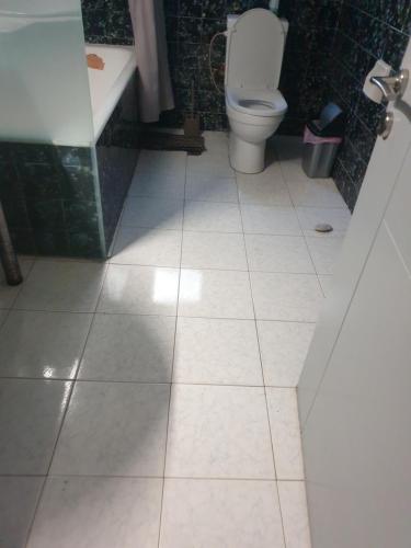 a bathroom with a toilet and a sink and a tub at O&M Port Piraeus in Piraeus