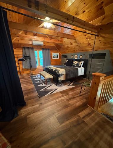 a bedroom with a bed in a room with wooden ceilings at Cozymountainretreat in Jasper