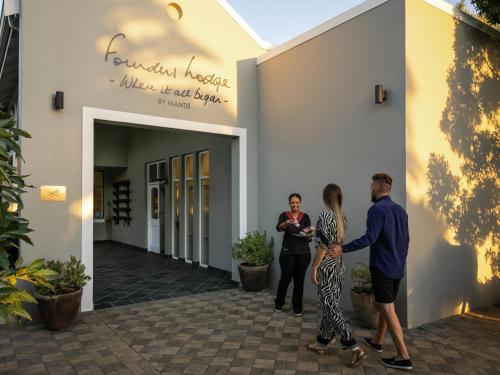a group of people standing outside of a building at Founders Lodge by Mantis in Paterson