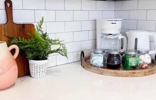 a counter top with jars and a coffee maker on it at 1500 Sq ft Space 2 Bed 2 Bath Large Kitchen in Conshohocken
