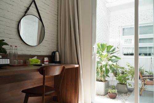 a home office with a mirror and a desk at 389 Hz Homestay in Danang