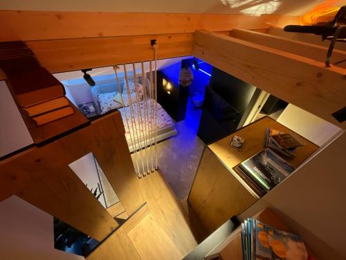 an overhead view of a room with a bed and stairs at Gleisbett 12-1 in Meiningen