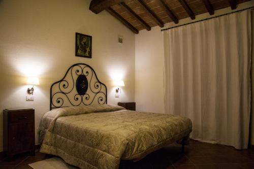Agriturismo I Rosetiにあるベッド
