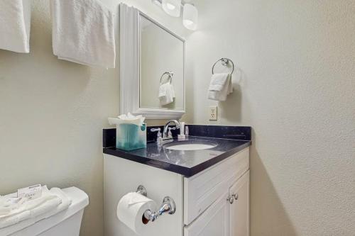a bathroom with a sink and a mirror at Tyra I B3D in Breckenridge