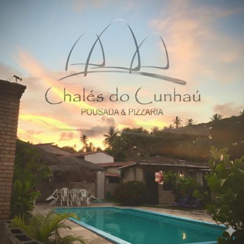 a view of a villa with a swimming pool at Pousada Chalés do Cunhaú in Canguaretama