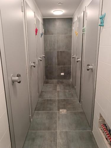 a walk in shower with stalls in a bathroom at Il Sassolino in Riomaggiore