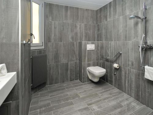 a bathroom with a toilet and a sink at ibis Lyon Centre in Lyon