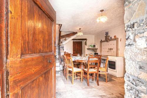 a dining room with a table and chairs at Luin Country House near Štanjel - Happy Rentals in Štanjel