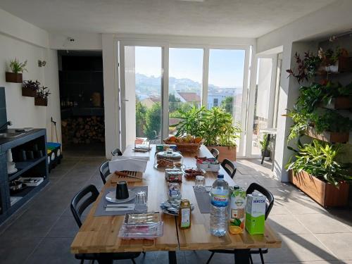 a table with food and water bottles on it at Casa Jasmim in Algueirão