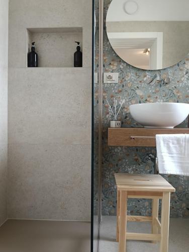 a bathroom with a sink and a mirror at La volpe e l'uva in Lavagno