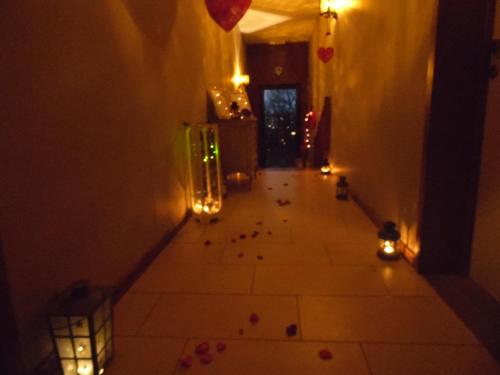 an empty hallway with candles and lights on the floor at Guest house Western-city in Chaudfontaine