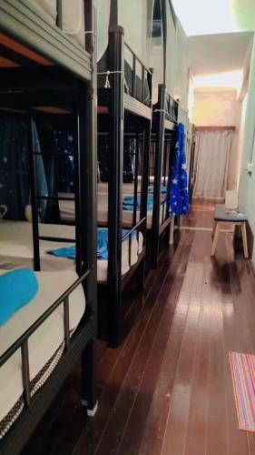 a row of bunk beds in a room at Pirate's Cove in Malacca
