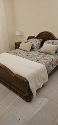 a bedroom with two beds with pillows on them at Orchard House South Room in Pergola