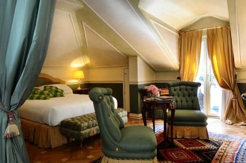 Postel nebo postele na pokoji v ubytování Petit Palais Hotel De Charme