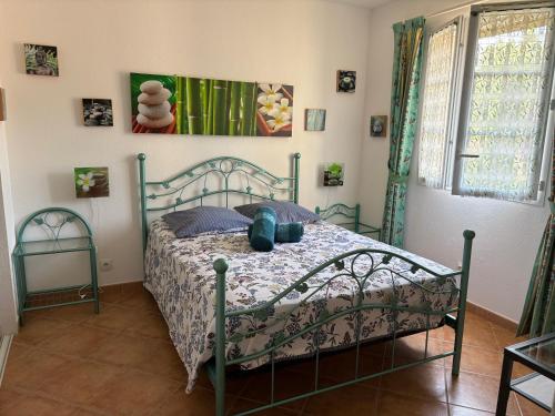 a bedroom with a bed in a room at Villa Aghjanella in Patrimonio