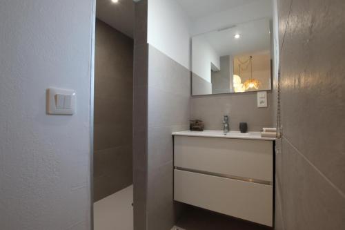 a bathroom with a sink and a mirror at Etche alabena - 2 in Ainhoa