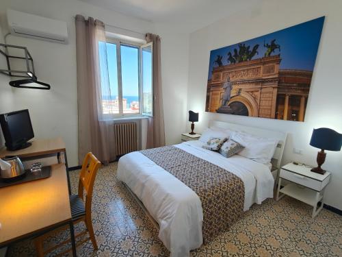 a hotel room with a bed and a window at Villa Cristina in Casteldaccia