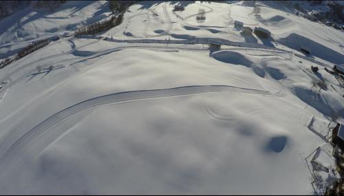 an aerial view of a snow covered field with snow at Casa Gion Giusep in Sedrun