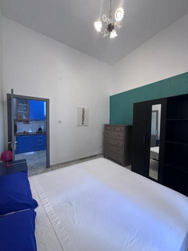 a bedroom with a bed and a dresser and a mirror at Vico Poerio 1 in Tursi
