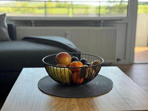 a bowl of fruit sitting on a table at Ferienwohnung BEST VIEW Brilon in Brilon