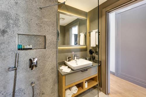 a bathroom with a sink and a shower at Celeste Bella Luxury Hotel & Spa in Bodrum City