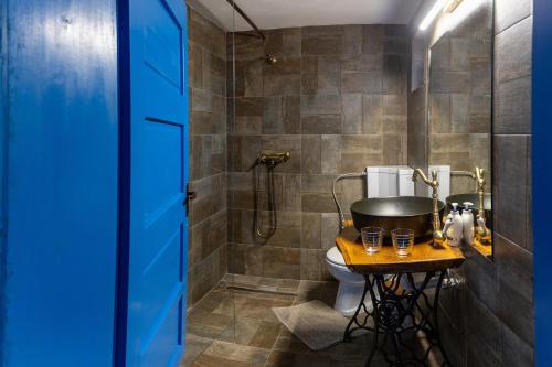 a bathroom with a tub and a toilet and a shower at CASA HAIDUCILOR Green Codru in Codru