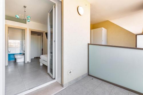 a hallway of a house with a door to a bathroom at B&B Acquamarina in Gallipoli
