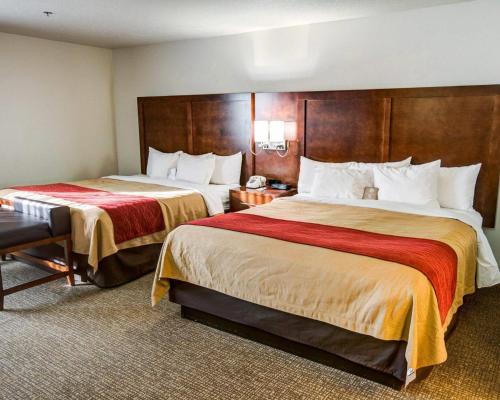 a hotel room with two beds in a room at Comfort Inn Redding Near I-5 in Redding