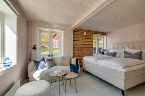a living room with a couch and a table at Arctic Nest in Nyksund