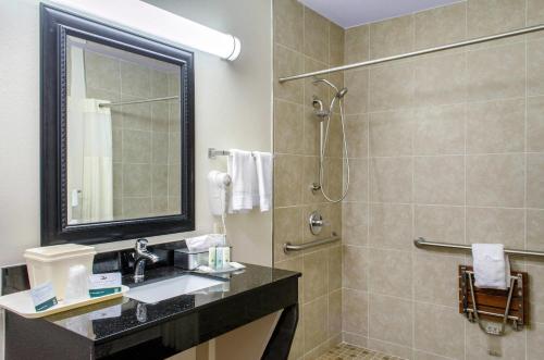a bathroom with a sink and a shower at Quality Inn McComb in McComb