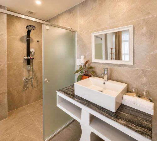 a bathroom with a sink and a shower at Terravia Hotel Sapa Moutain View in Sapa