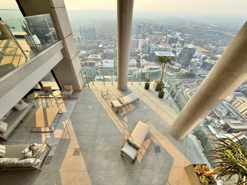 a view from the top of a building with chairs and tables at The Leonardo in Johannesburg