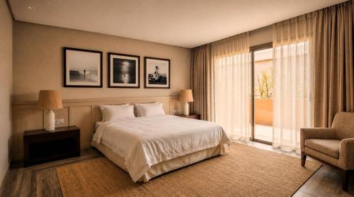 a bedroom with a bed and a chair and a window at The Riad by Blue Waves in Agadir