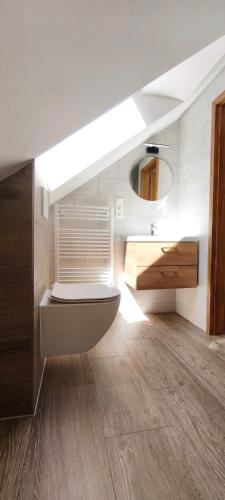 a bathroom with a sink and a toilet in it at Špulka Hideaway - Romantic Forest Escape near Prague in Teplýšovice